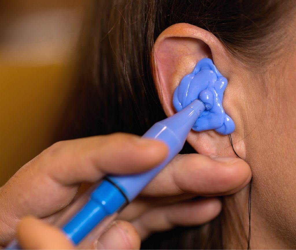 Demonstration of a molded ear plug at Timaru Occupational Health and Safety
